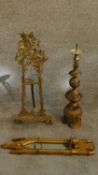 A collection of brass items and a giltwood gothic style mirror. A pierced brass floor candlestick