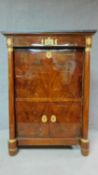 A 19th century mahogany Empire style secretaire a abbatant with ormolu mounts and fitted interior