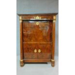 A 19th century mahogany Empire style secretaire a abbatant with ormolu mounts and fitted interior