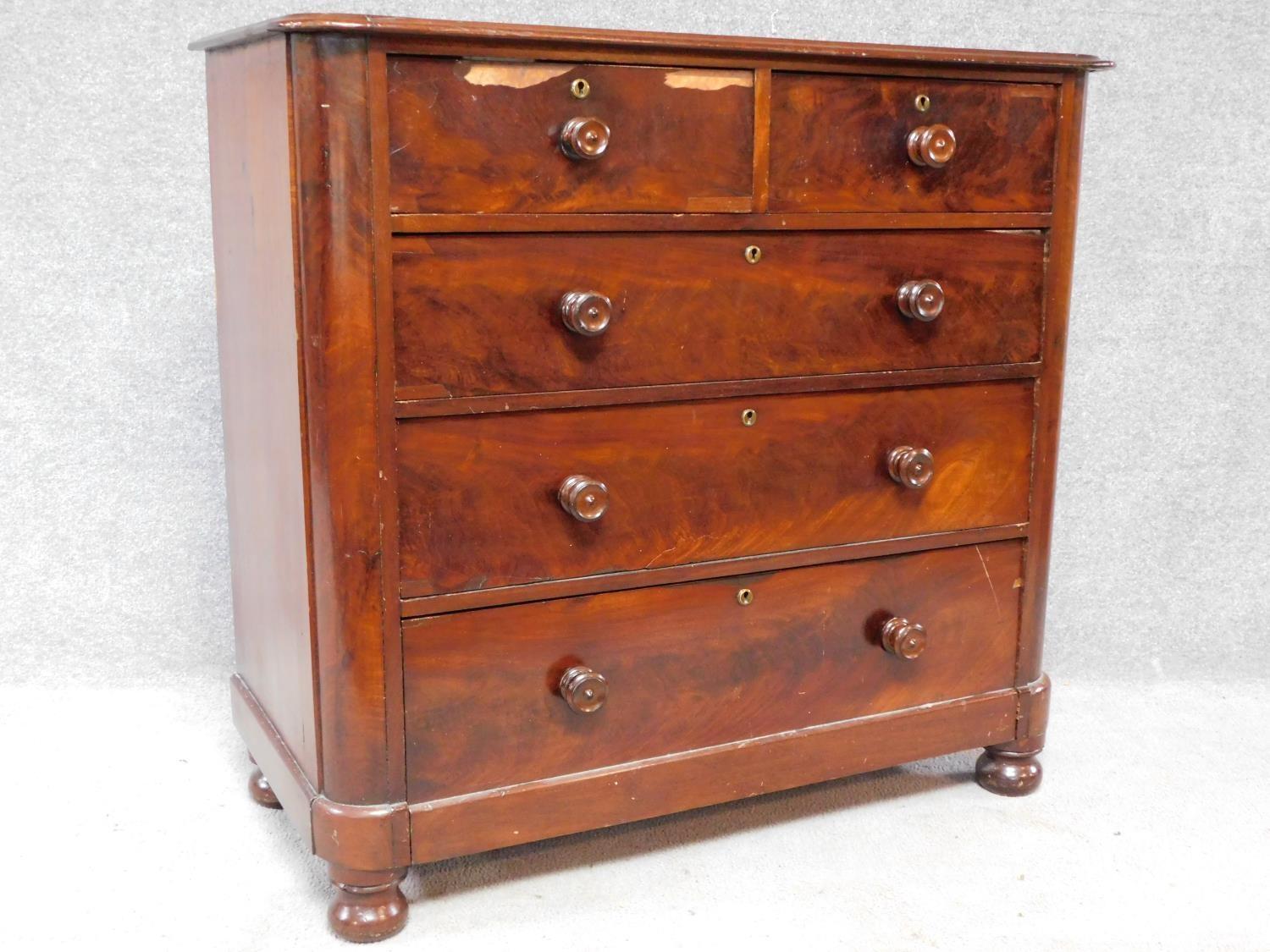 A Victorian mahogany chest of two short over three long drawers, raised on squat turned supports. - Image 2 of 8