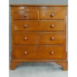 A Victorian oak and mahogany chest of two short over three long drawers flanked by pilasters