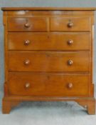 A Victorian oak and mahogany chest of two short over three long drawers flanked by pilasters