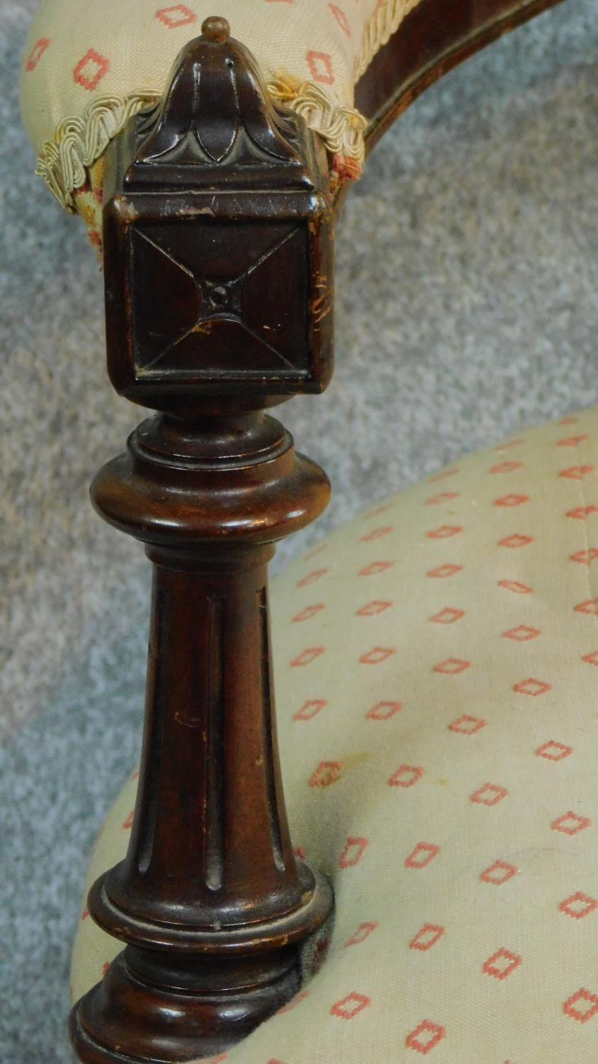 A Victorian carved mahogany framed open arm two seater sofa on turned tapering supports. H.104 W. - Image 7 of 9