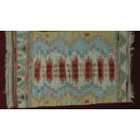 A flatwoven Kelim style rug patterned and fringed 165x105