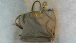 An original Prada woman's grey leather handbag. H.40 W.39cm