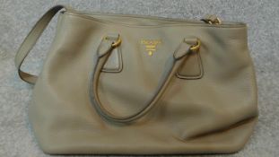 An original Prada woman's grey leather handbag. H.43 W.26cm