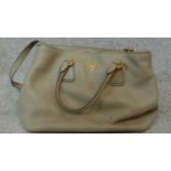 An original Prada woman's grey leather handbag. H.43 W.26cm