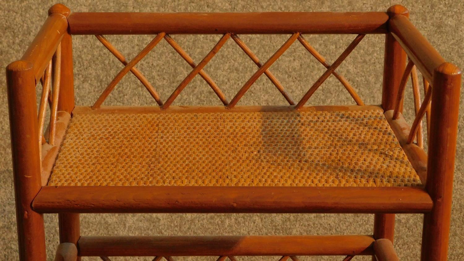 A 20th century teak and rattan whatnot. H.96 W.38 D.25cm - Image 3 of 4