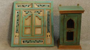 A 19th Century Javanese decorative wall mounted mirror with doors and carved floral together with