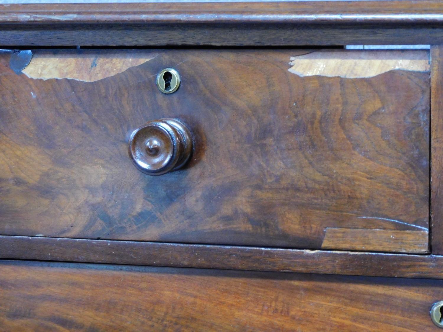 A Victorian mahogany chest of two short over three long drawers, raised on squat turned supports. - Image 7 of 8