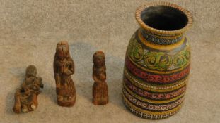 A trio of antique carved wooden figures and a painted polychrome turned vase. H.28cm