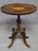 An Edwardian mahogany wine table with urn inlay raised on fluted quadruped supports. H.55cm