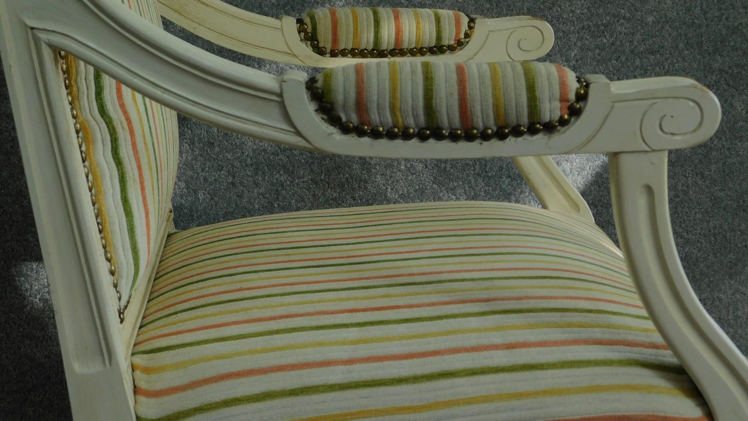 A Louis XVl style painted white armchair in striped upholstery and raised on tapering fluted - Image 4 of 7