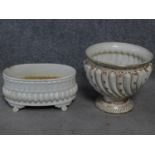 A pair of antique porcelain planters. One with gilded and floral decoration. Makers stamp to the