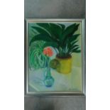A silver framed oil on canvas depicting two plants in vases, signed Anni Carrick. 56x72cm