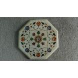 An Indian pietra dura inlaid white marble board. Inlaid with various precious gemstones such as