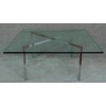 A contemporary square plate glass topped table on chrome base. H.46 W.100 D.100cm