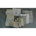 A collection of twelve linen and lace table cloths of different sizes and designs. 290x131cm (