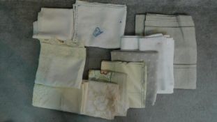 A collection of twelve linen and lace table cloths of different sizes and designs. 290x131cm (