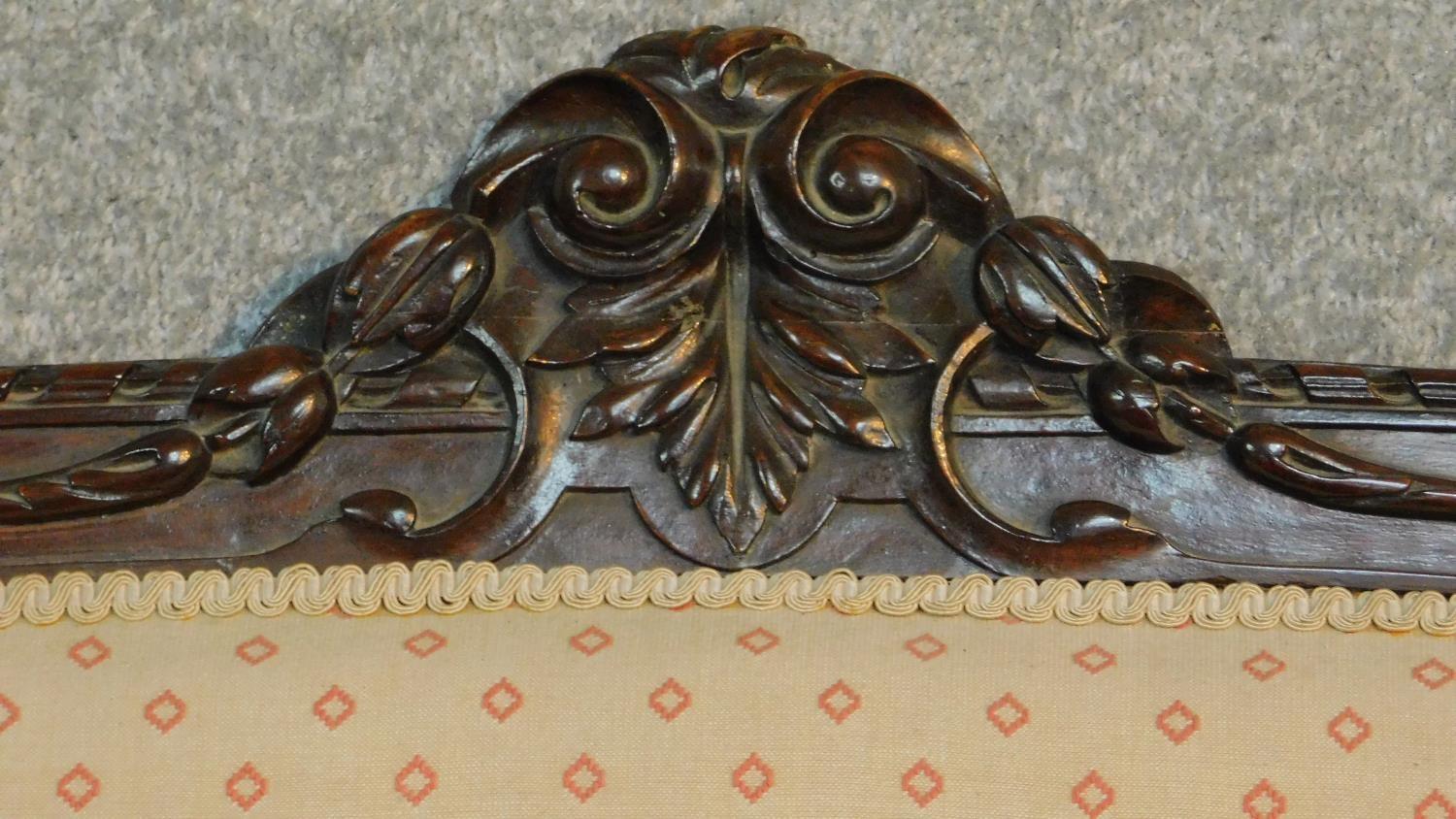 A Victorian carved mahogany framed open arm two seater sofa on turned tapering supports. H.104 W. - Image 2 of 9