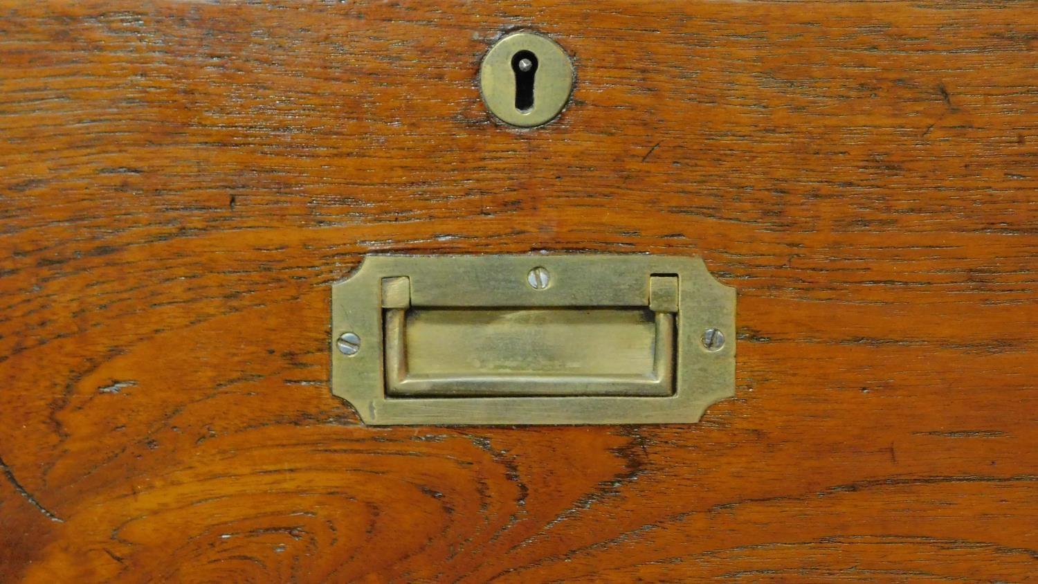 A 19th century teak two part brass bound military campaign chest fitted inset brass handles. H.98 - Image 4 of 7