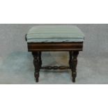 An Edwardian mahogany adjustable piano stool raised on stretchered turned tapering supports. H.46