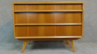 A vintage oak chest of three drawers by Hunt for James Philips & Sons raised on splay legs, makers