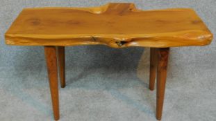 A vintage natural form yew wood bench by Reynolds of Ludlow. H.40 W.74 D.37cm