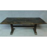 An antique country oak refectory dining table on stretchered platform support. H.76 W.213 D.82cm
