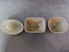 Three Victorian ceramic jelly moulds with pineapple, turkey and fish motifs. H.10cm