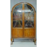 A mid 20th century Art Deco style mahogany bookcase, astragal glazed section above panel doors