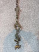 Antique hanging engraved brass Indian animals on a fancy link brass chain with hook at end. Length