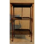 An Edwardian mahogany whatnot fitted with folio divider on cabriole supports. H.86 W.48 D.27cm