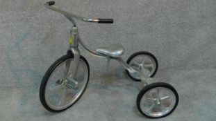 A convertible vintage tricycle designed in 1949 by Tony Anthony, aluminium frame and seat with