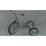 A convertible vintage tricycle designed in 1949 by Tony Anthony, aluminium frame and seat with