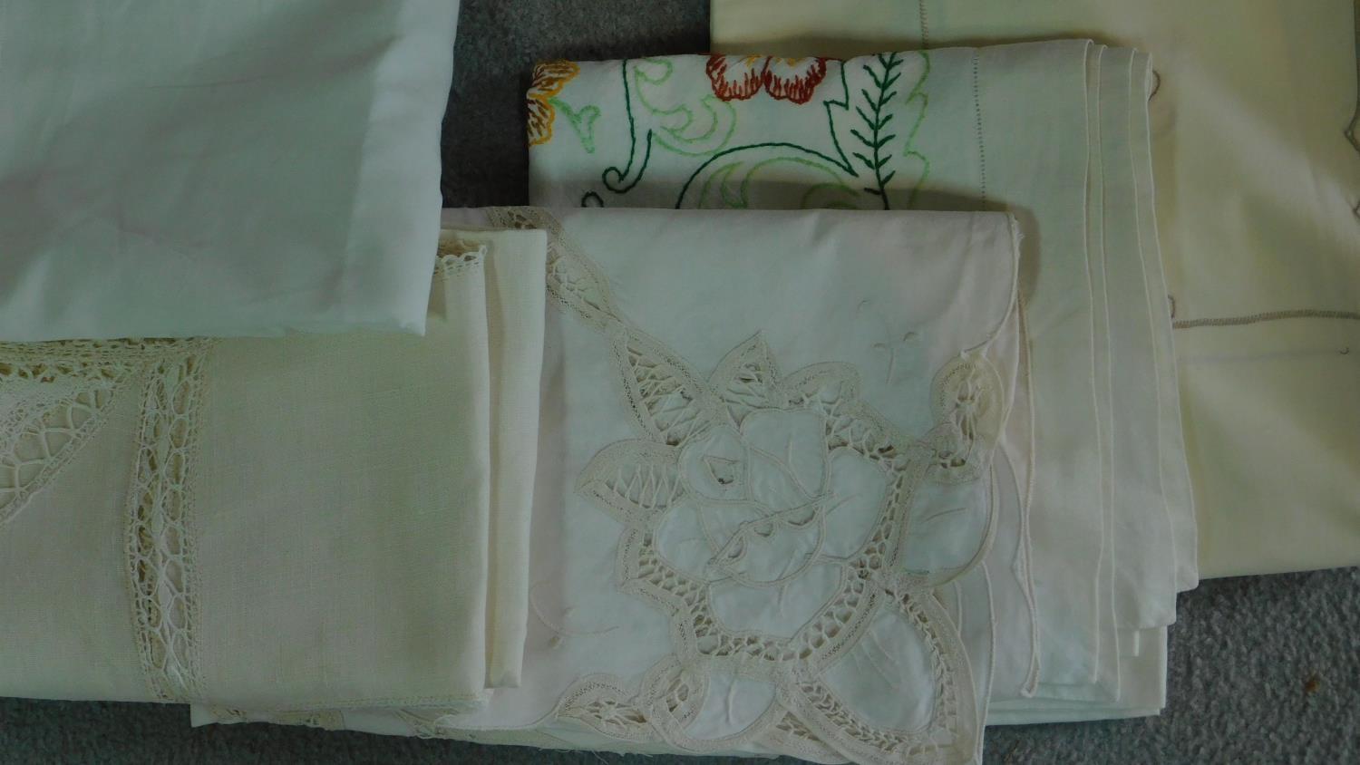 A collection of twelve linen and lace table cloths of different sizes and designs. 290x131cm ( - Image 3 of 4