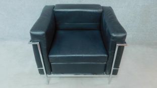 A contemporary Le Corbusier style black leather armchair on chrome frame. H.71 W.87 D.71cm