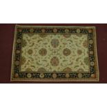 A Kashan style rug, all over spandrel motifs with repeating petal motifs on an ivory field,