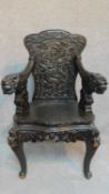 An early 20th century Chinese hardwood chair with dragon carving, raised on cabriole legs. H.101cm