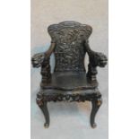An early 20th century Chinese hardwood chair with dragon carving, raised on cabriole legs. H.101cm