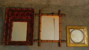 A bamboo effect wall mirror, a painted polychrome mirror and an embossed framed mirror. 52x40cm (