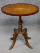 An Edwardian mahogany wine table with shell inlay raised on quadruped swept supports. H.55cm