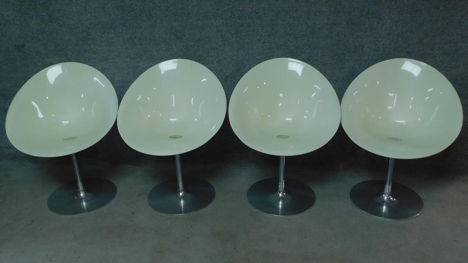 A set of four vintage white moulded chairs on chrome frames, by Ero (S) Kartell. H.83cm