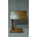 A 19th century mahogany adjustable and tilting reading stand on fluted support on platform catered