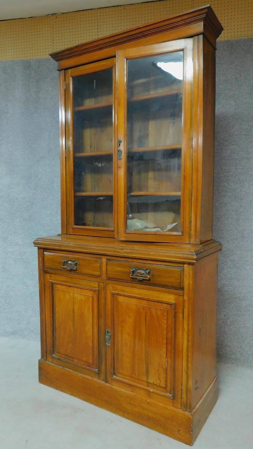 A Victorian oak library bookcase, the upper glazed section above panelled doors on plinth base. H. - Image 2 of 7