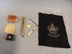 Collection of rolled gold pens, yellow enamel and silver St Christopher and other items, including a