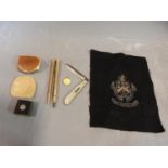 Collection of rolled gold pens, yellow enamel and silver St Christopher and other items, including a