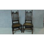 A near pair of antique country oak chairs raised on stretchered turned supports. H.103cm
