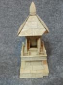 An antique carved Japanese ivory Okimono Dragon temple statue and vintage light in the form of a