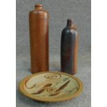 A pair of German and Dutch antique terracotta glazed bottles with embossed maker and seal along with